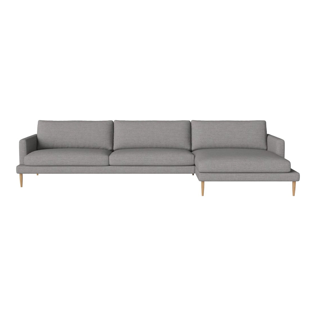 Modern gray sectional sofa with clean lines and a minimalist design, featuring a solid color upholstery and light wood legs.