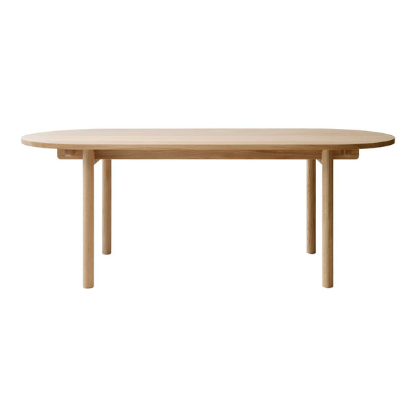 Natural wood finish oval table with a smooth surface and minimalist design, showcasing light beige tones and clean lines.