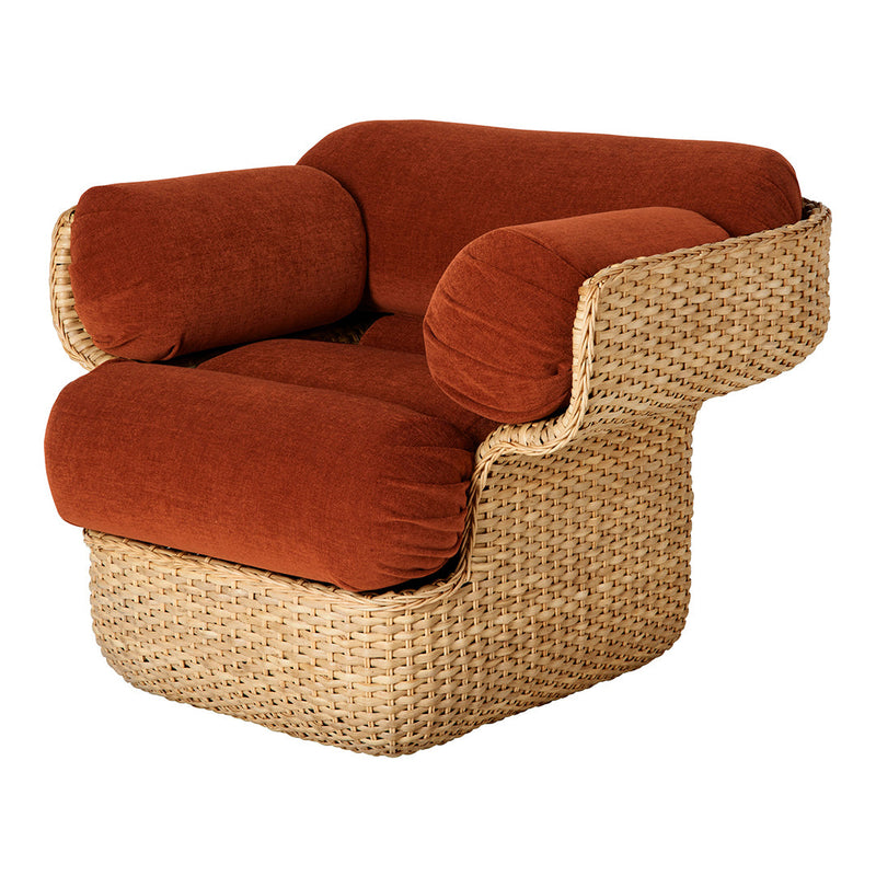 Rust-colored cushions on a woven natural rattan frame, featuring a modern, curved design. Perfect for stylish decor.