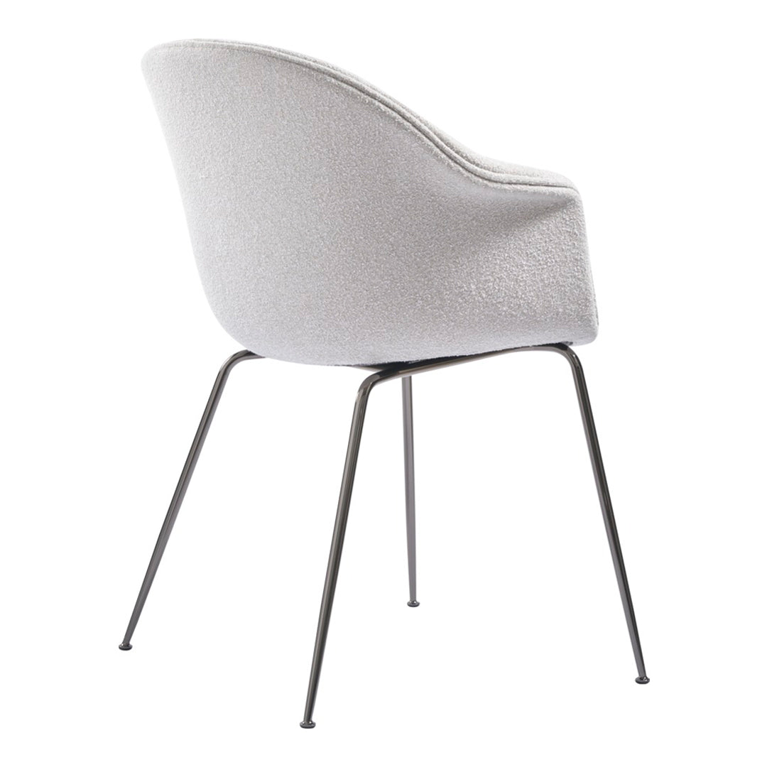 Light gray upholstered chair with a textured finish and sleek metal legs. Elegant and modern design.