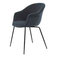 Stylish dark gray velvet chair with sleek black metal legs, perfect for modern decor.