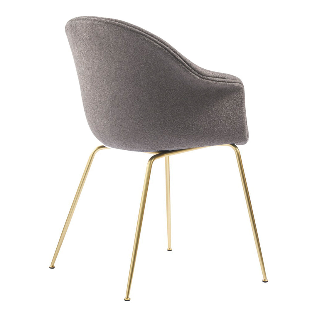Gray upholstered chair with a smooth, curved design and sleek gold metal legs. Ideal for modern interiors.