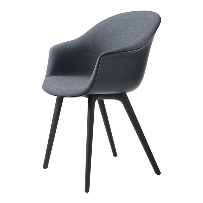 Stylish gray fabric chair with smooth curves and sleek black legs, perfect for modern decor.