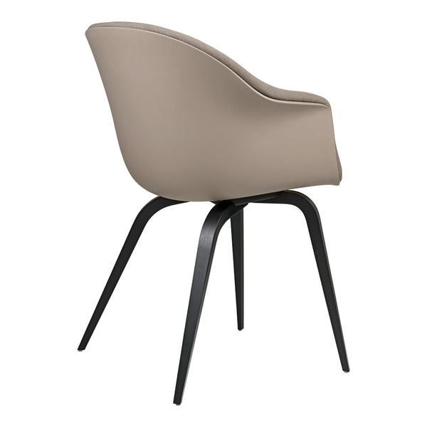 Beige upholstered chair with sleek black metal legs, featuring a smooth and modern design. Perfect for any decor.