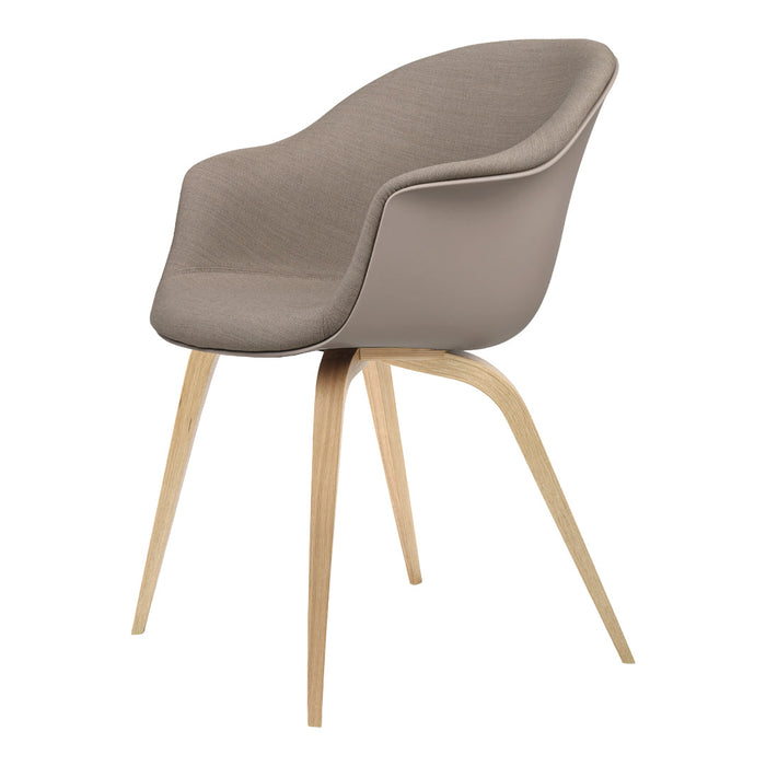 Grey upholstered chair with smooth curves, featuring natural wood legs for a modern and minimalist look.