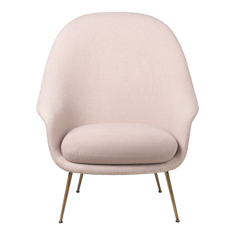Soft pink armchair with smooth fabric and sleek gold legs, perfect for modern minimalist decor.