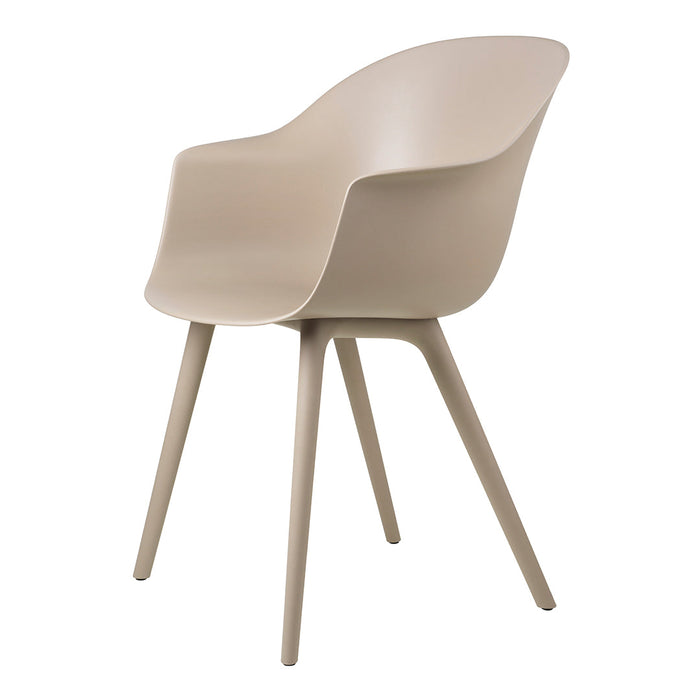Beige molded chair with smooth, minimalist design and matte finish. Perfect for modern home decor.