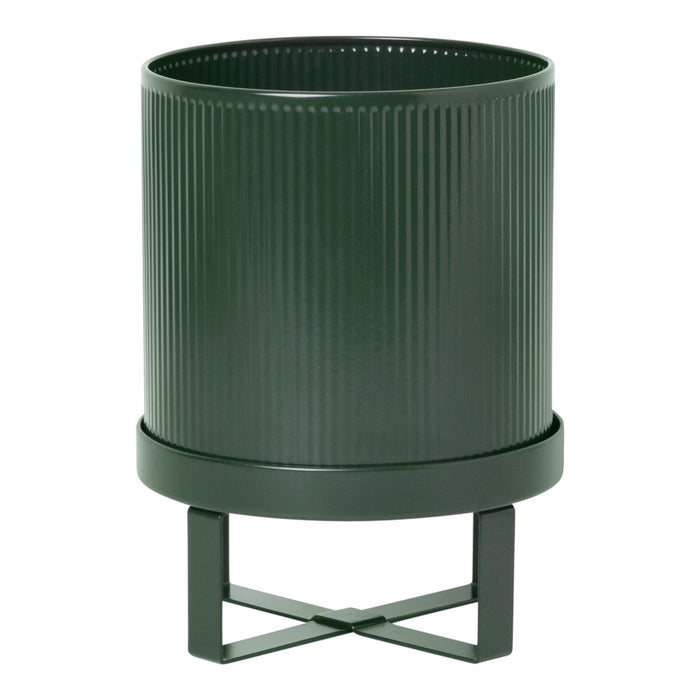Dark green ribbed planter with a sleek black stand, featuring a modern, minimalist design.