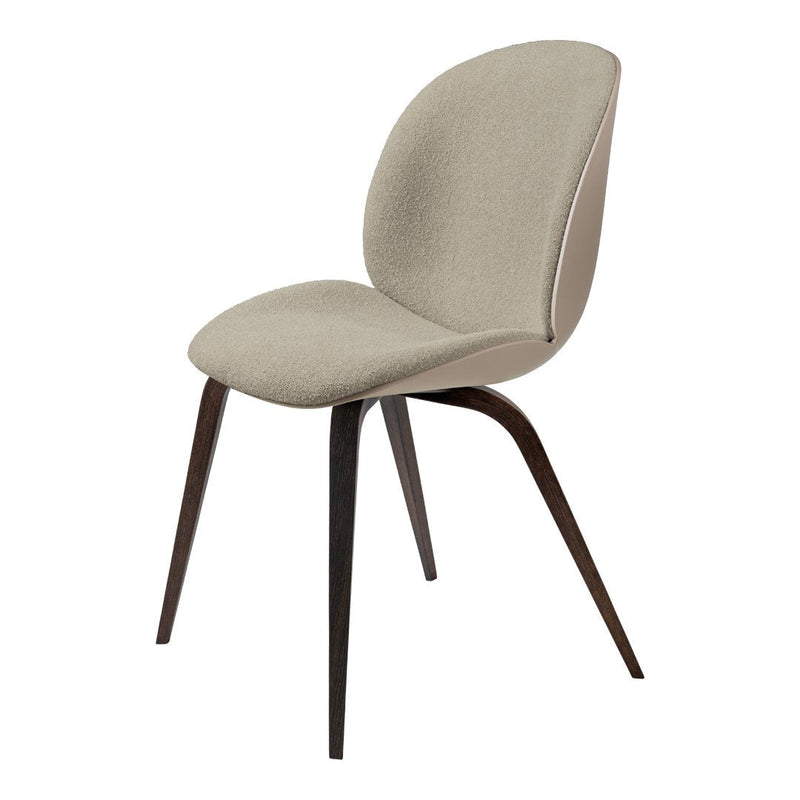 Beige upholstered chair with smooth contours and dark wood legs, perfect for modern decor.