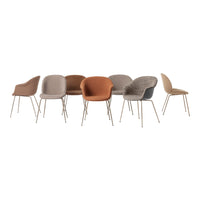 "Collection of modern chairs in warm tones of brown, beige, and gray with sleek gold legs and various textured patterns."