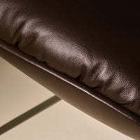 Brown faux leather cushion with a smooth, textured finish and subtle pleating detail.