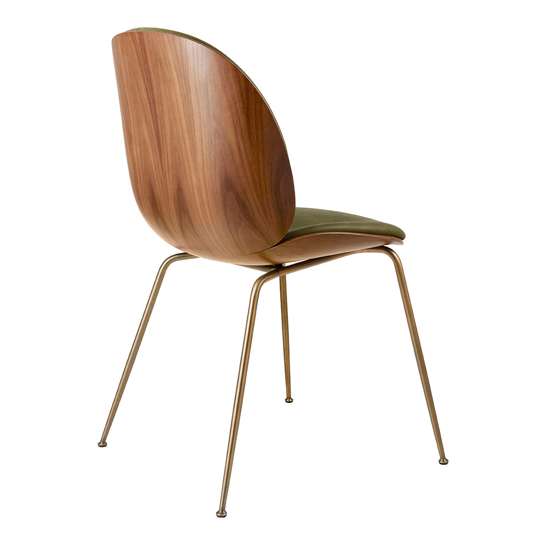 Wooden chair with a walnut finish and green upholstery on a sleek metal base. Simple, modern design.