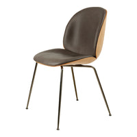 Modern chair featuring a dark gray seat with a wooden backrest and sleek black metal legs. Simple, stylish design.