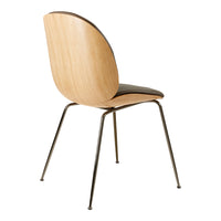 Natural wood grain with a sleek black seat, supported by slender metallic legs. Modern, minimalist design.