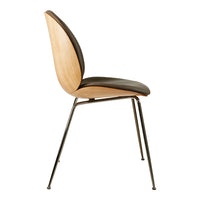 Side view of a modern chair featuring a natural wood finish, sleek black upholstery, and minimalist metal legs.