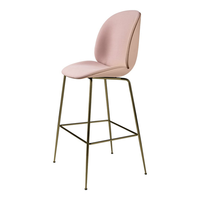 Pink upholstered stool with minimalist design and gold metal legs, perfect for modern interiors.