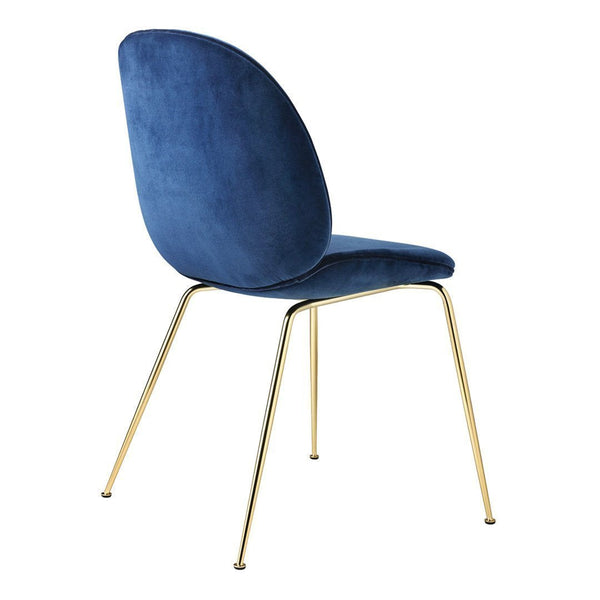 Blue velvet dining chair with sleek gold legs, featuring a smooth and modern design. Ideal for stylish interiors.