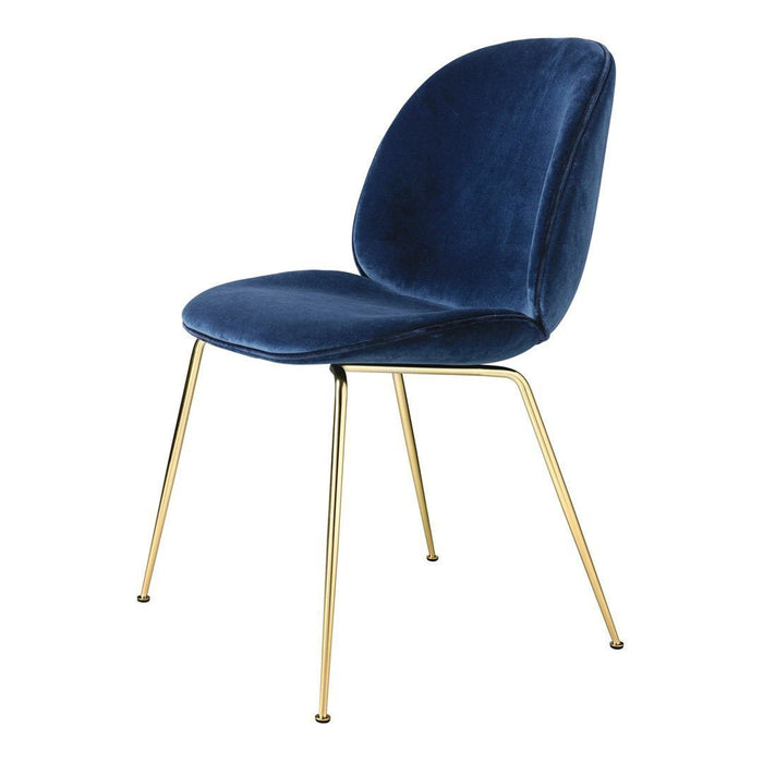Navy blue velvet chair with sleek gold legs, featuring a modern, minimalist design. Perfect for elegant interiors.
