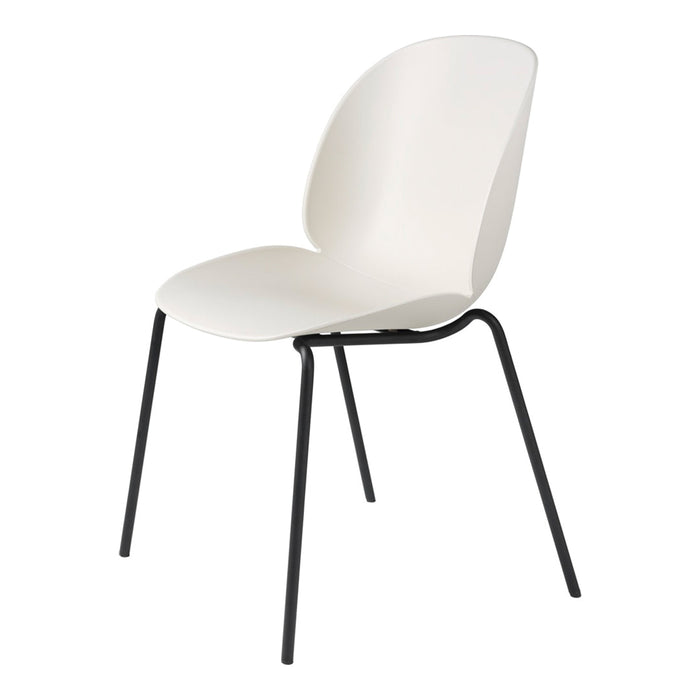 White modern chair with a smooth finish and sleek black metal legs, ideal for minimalist decor.