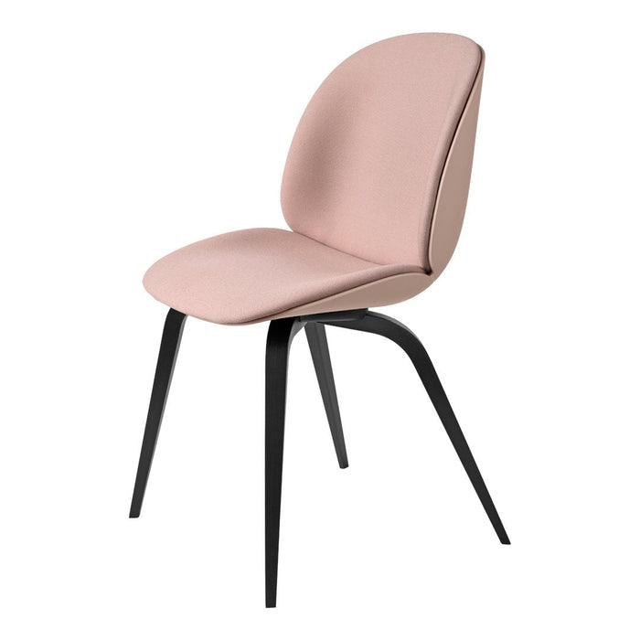Blush pink upholstered chair with sleek black legs, featuring a smooth, modern design. Perfect for contemporary spaces.