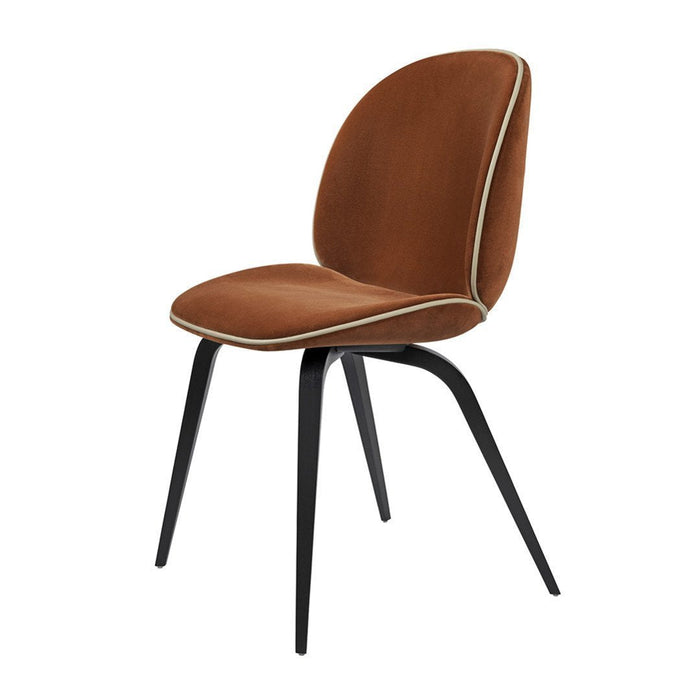 Brown upholstered chair with contrasting white piping and sleek black legs. Modern design for any space.