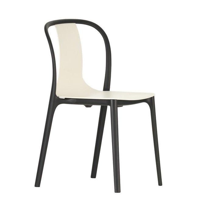 Minimalist black chair with a cream seat, featuring sleek lines and a modern design. Perfect for any stylish space.