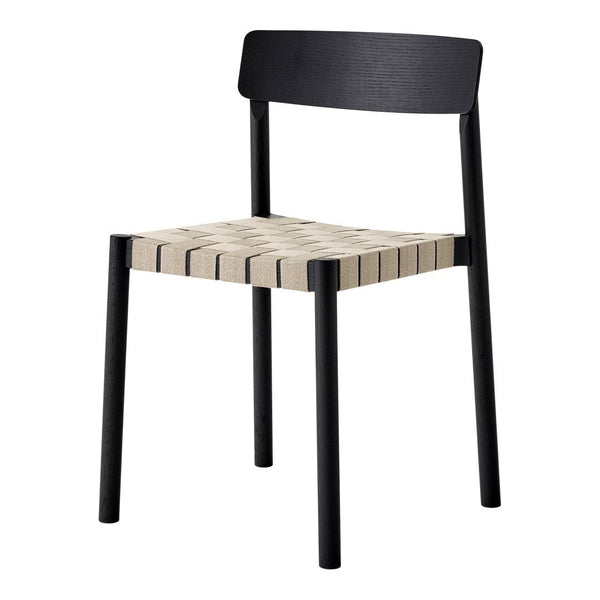 Black wooden chair with a beige woven seat and minimalistic design, showcasing sleek lines and modern style.