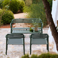 Green outdoor seating set with striped pattern and sleek, modern design. Perfect for garden or patio spaces.