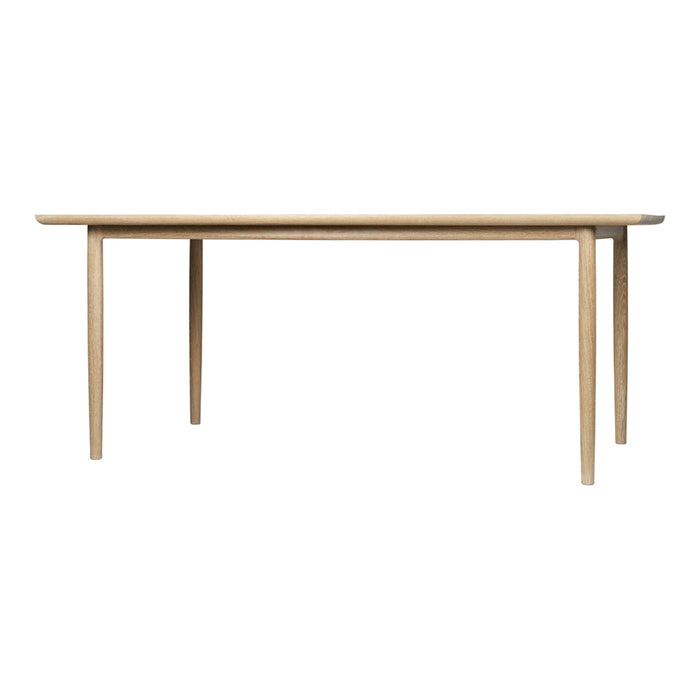 Light natural wood dining table with a simple, unobtrusive design and smooth, clean lines. Ideal for any decor.