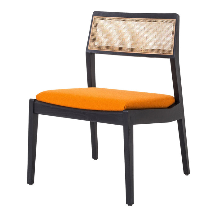 Black frame chair with a woven back and vibrant orange cushion, perfect for adding a pop of color to any space.