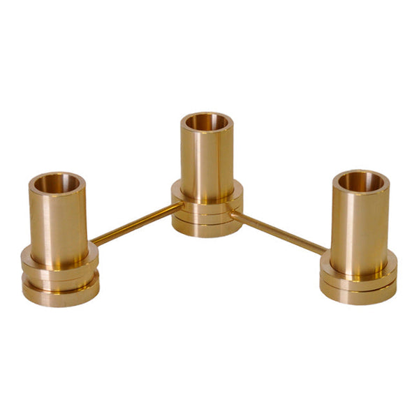 Brass candle holder with a shiny, gold finish and sleek, modern design featuring three cylindrical holders.