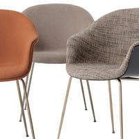 Stylish chairs in rust, grey, and textured patterns with metallic legs, perfect for modern decor.