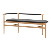 Modern wooden bench with a natural finish and a sleek black leather cushion. Stylish and minimalist design.