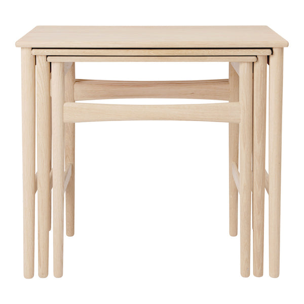 Light oak nested tables with a minimalist design, featuring smooth, natural wood grain and clean lines.