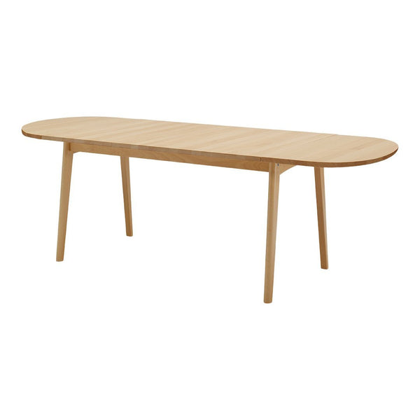 Light oak wood dining table with a smooth, oval top and simple tapered legs, exuding a modern, minimalist aesthetic.