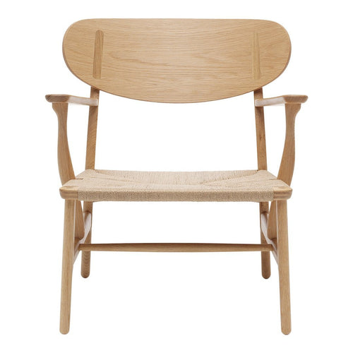 Light oak chair with a natural woven seat and minimalist design, showcasing smooth wood grain and soft curves.