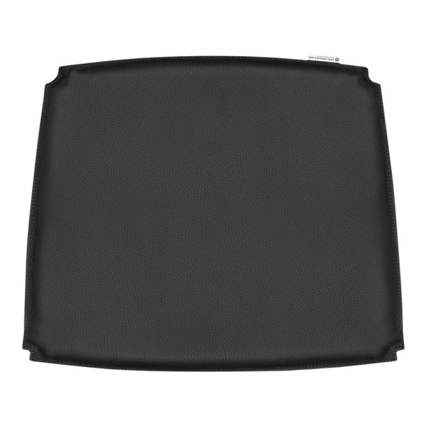 Black square griddle with a smooth, non-stick surface, perfect for even cooking and easy cleaning.