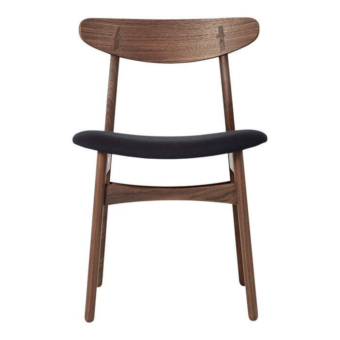 Wooden chair with a dark walnut finish and a sleek black seat cushion, showcasing a minimalist design.
