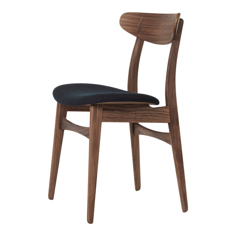 Walnut wooden chair with a sleek design and a black upholstered seat, featuring smooth lines and natural finishes.