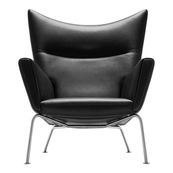 Black leather armchair with sleek, modern design and smooth, curved lines on silver legs.