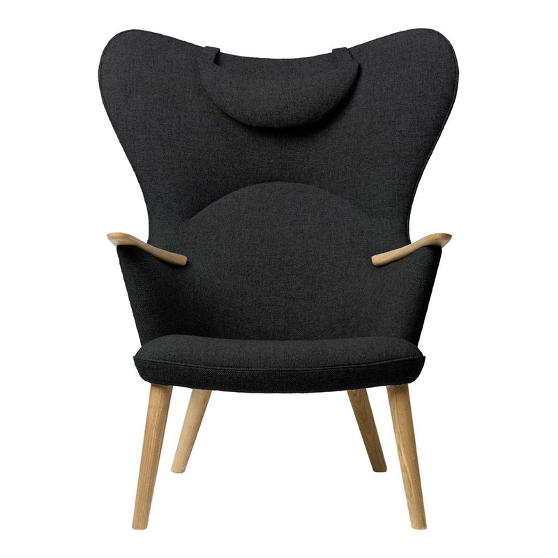 "Stylish black upholstered chair with a unique butterfly shape and wooden legs, perfect for modern decor."