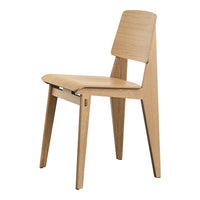 Natural wood chair with a minimalist design, featuring light oak tones and clean, seamless lines.