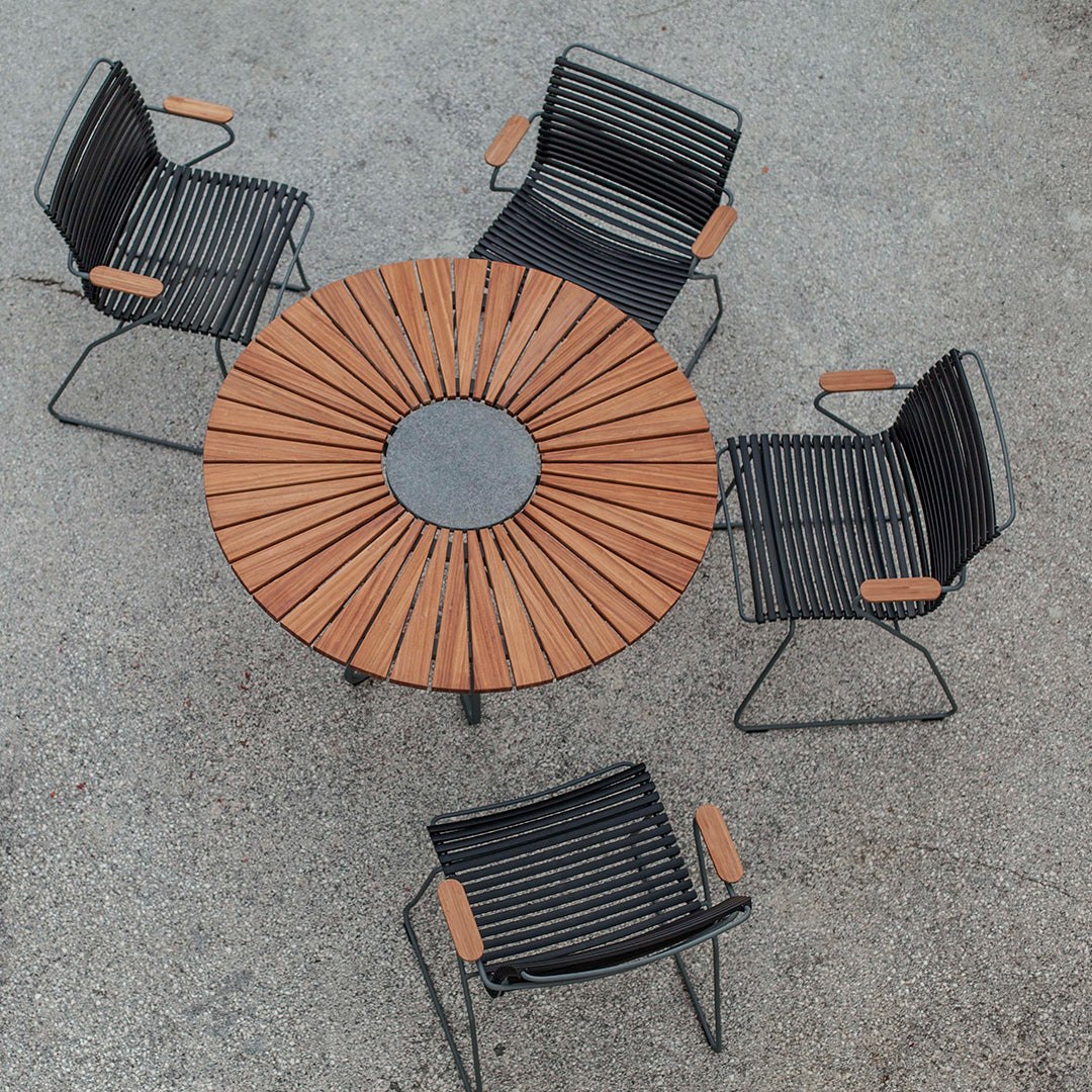 Black and wooden outdoor dining set with modern striped pattern and circular table design, ideal for patios.