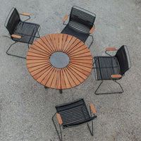 Black and wooden outdoor dining set with modern striped pattern and circular table design, ideal for patios.
