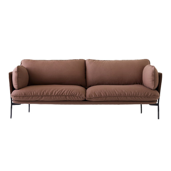 Brown upholstered sofa with smooth cushions and round side pillows, set on a sleek black metal frame.