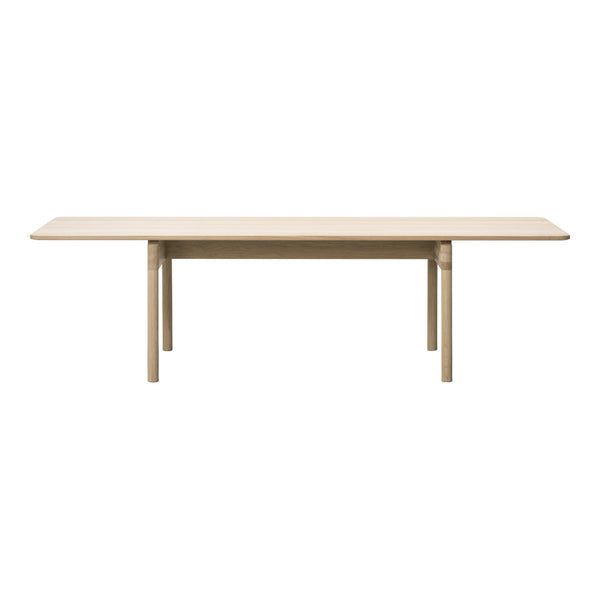 Light natural wood dining table with a sleek, minimalist design and smooth finish. Perfect for any modern decor.