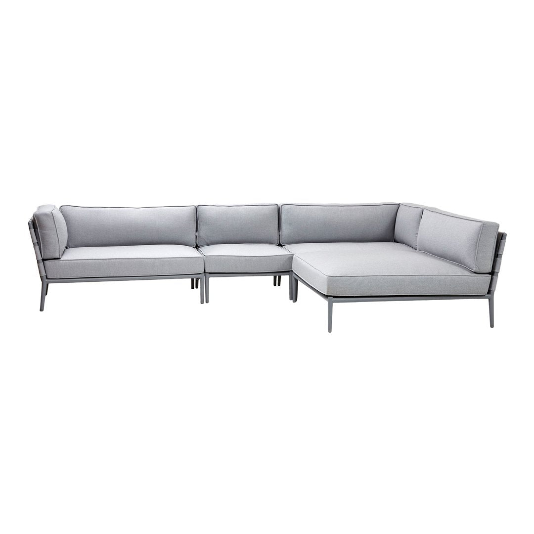 Modern gray sectional sofa with sleek lines and soft cushions, perfect for contemporary spaces.