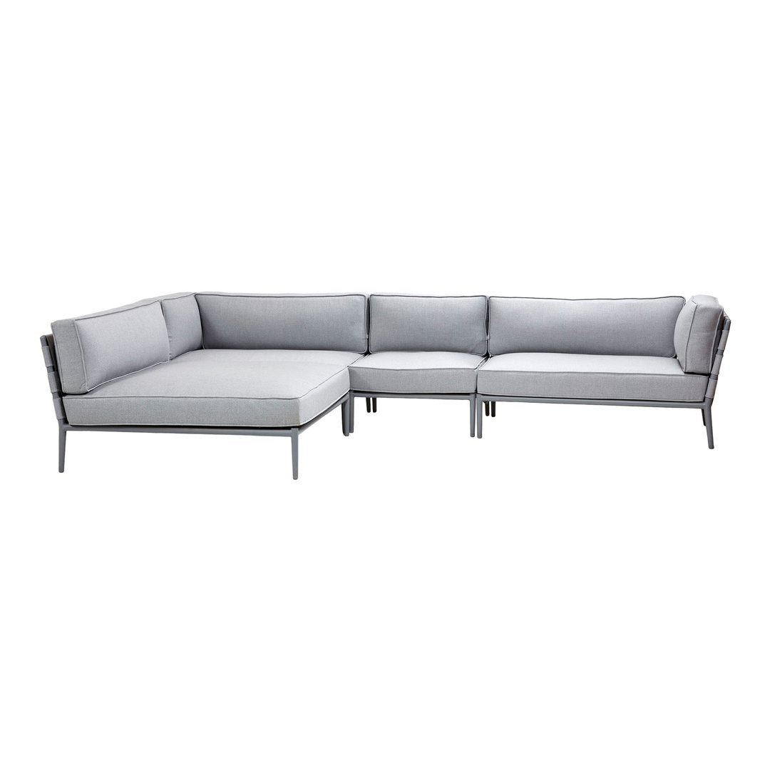 Modern gray sectional sofa with sleek lines and minimalistic design, perfect for contemporary living spaces.