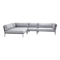 Modern gray sectional sofa with sleek lines and minimalistic design, perfect for contemporary living spaces.