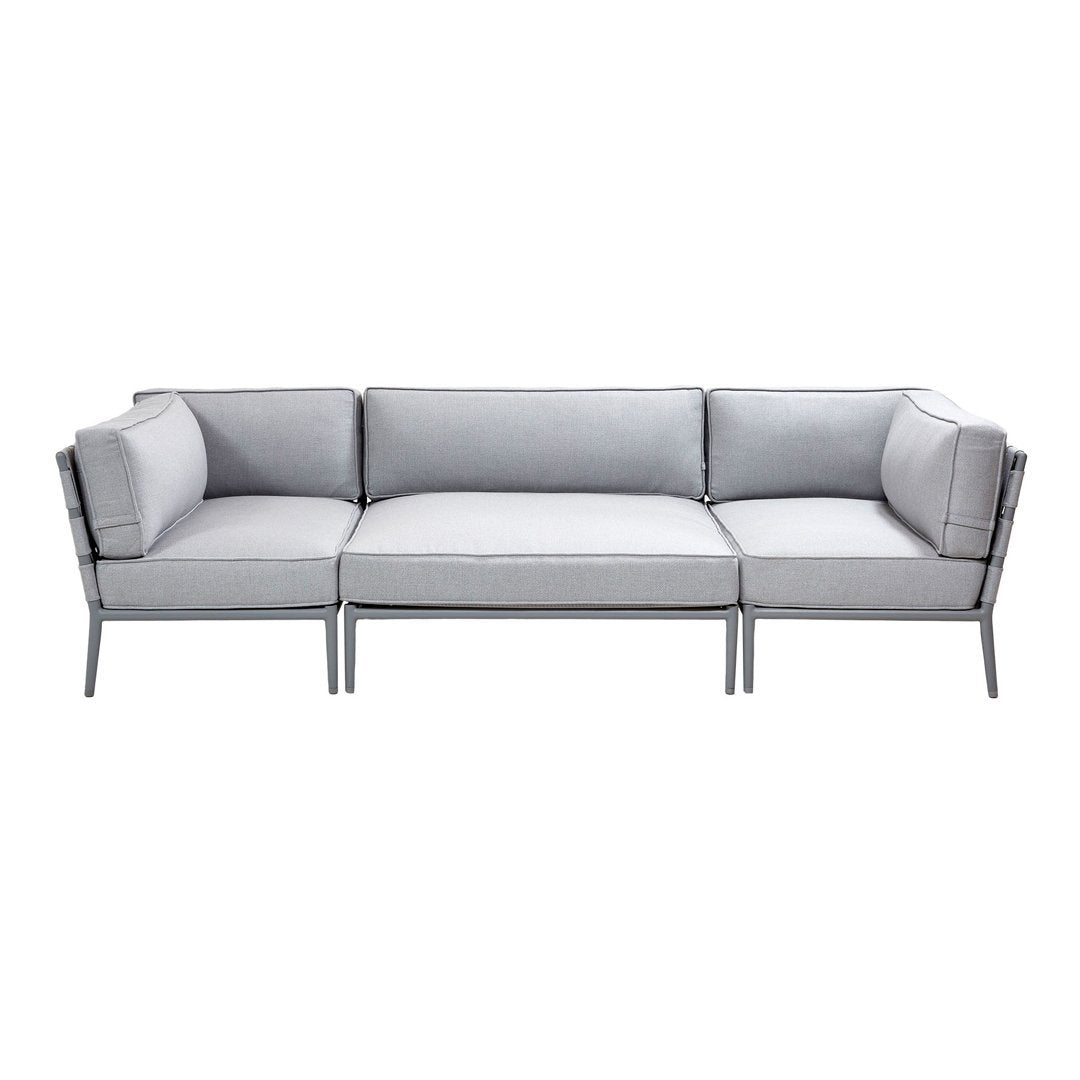 Modern gray sectional sofa with sleek metal frames, featuring a minimalist design and clean lines. Perfect for contemporary spaces.